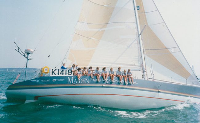 A group of people on a sailboat.