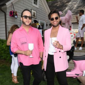Two men in pink blazers.