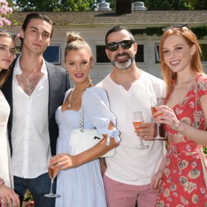 A group of people posing for a photo at an outdoor event.