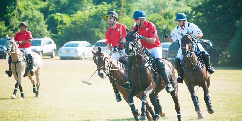 A group of men playing polo on horses.