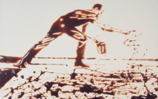 Artistic depiction of a man painting or creating on a surface with dynamic brushstrokes.