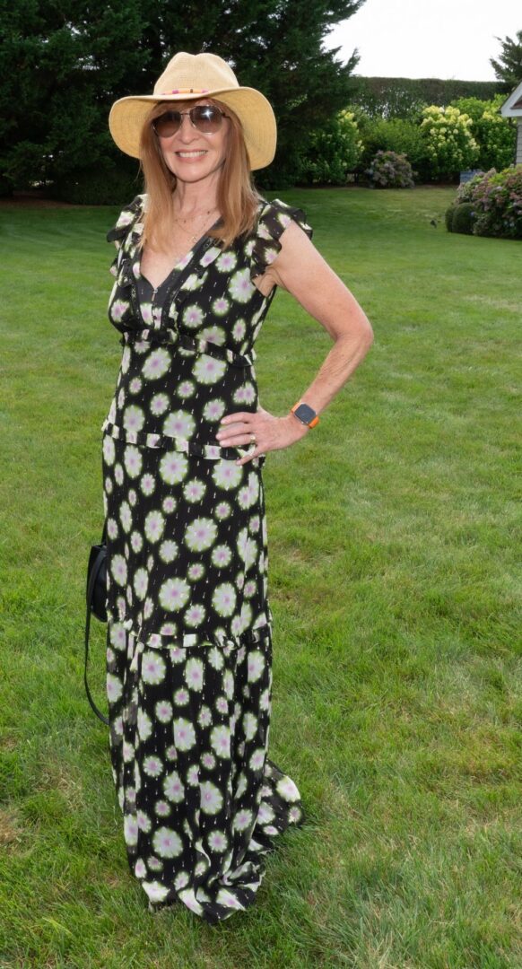 Young man with a slight smile against a gray background.