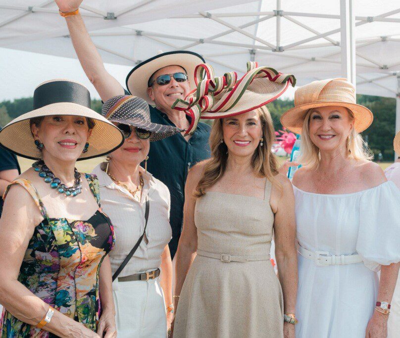 Young man with a slight smile against a gray background.