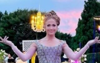 Woman in a purple dress at a party.