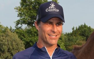 Man in Equuleus Polo Team hat.