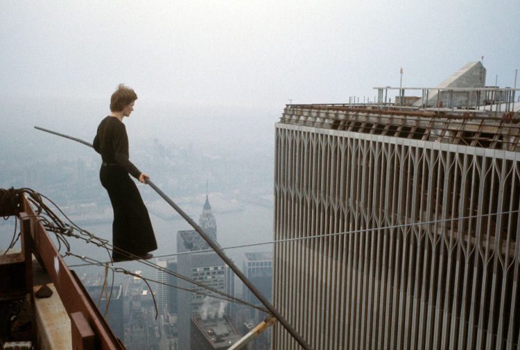 Man tightrope walking on World Trade Center.