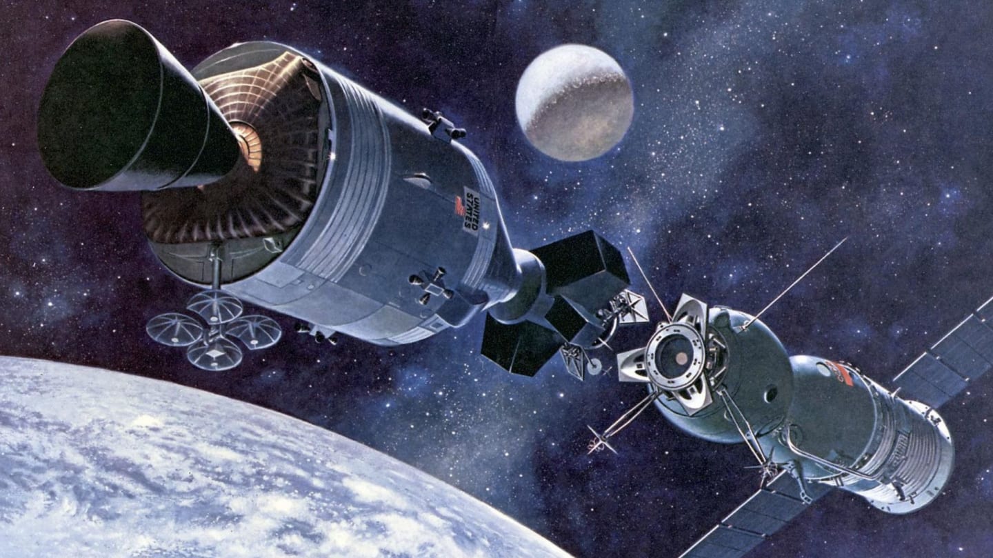 Two spacecraft docked in orbit above Earth with the Moon in the background.