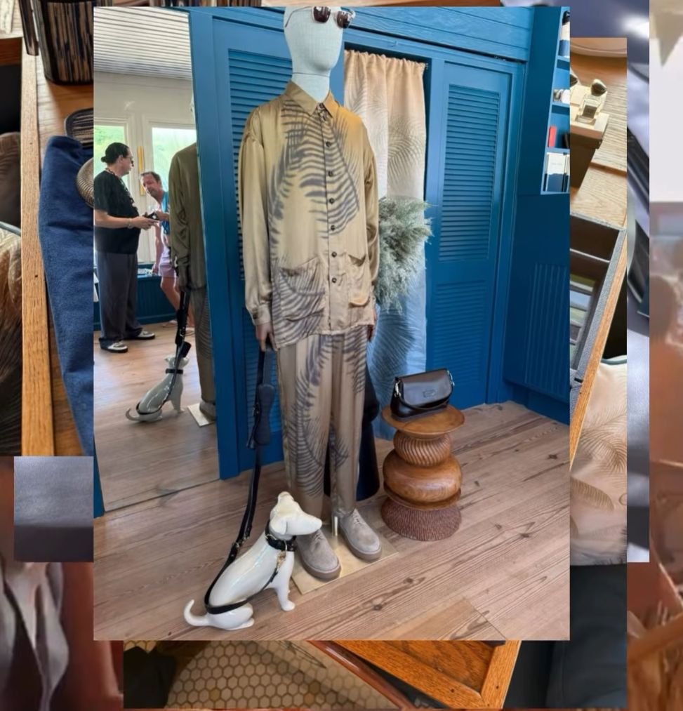 Mannequin dressed in skeleton print outfit with matching dog mannequin in a boutique.